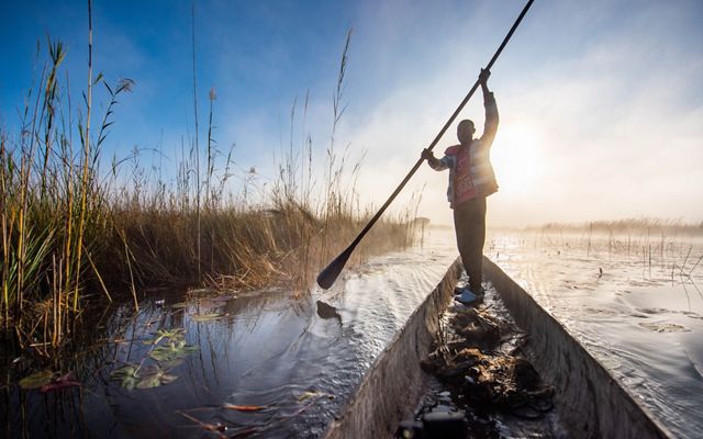 Augusto Chihinga checks his fishing nets in the lagoon near Livambi Village, Angola. 