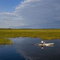 Shannon Wadena and his son, Shannon Jr. (right),  work their canoe across Upper Rice Lake near Bagley, Minnesota.