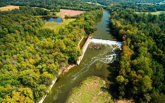The Green River in Kentucky going through farms and forest.
