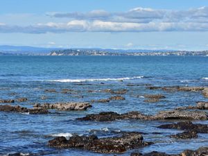 A view of the bay with a city in the background.