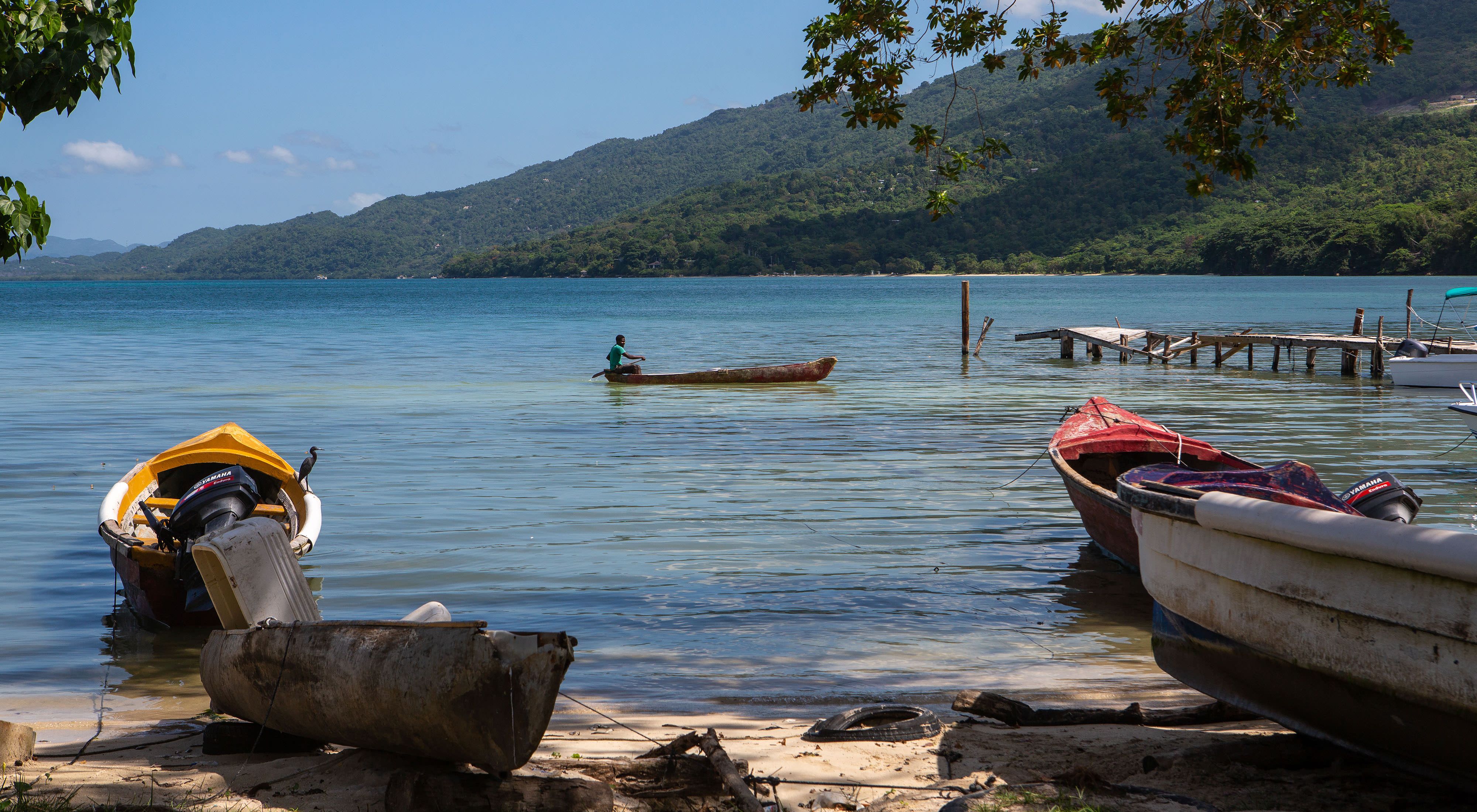 A fisher returns to shore at the end of the day.