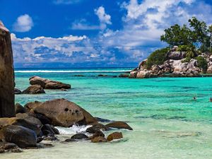 snorkelers in crystal blue waters