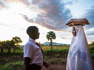 Two girls in school uniforms.